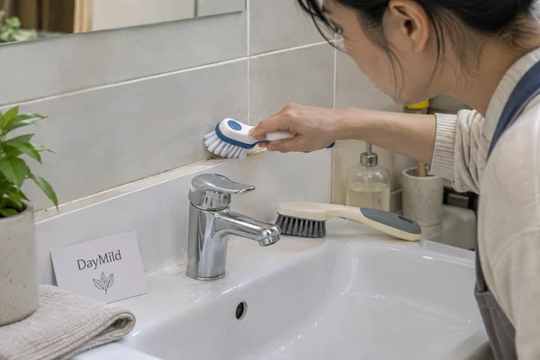 Illustrative DayMild bathroom cleaning brushes household application sample